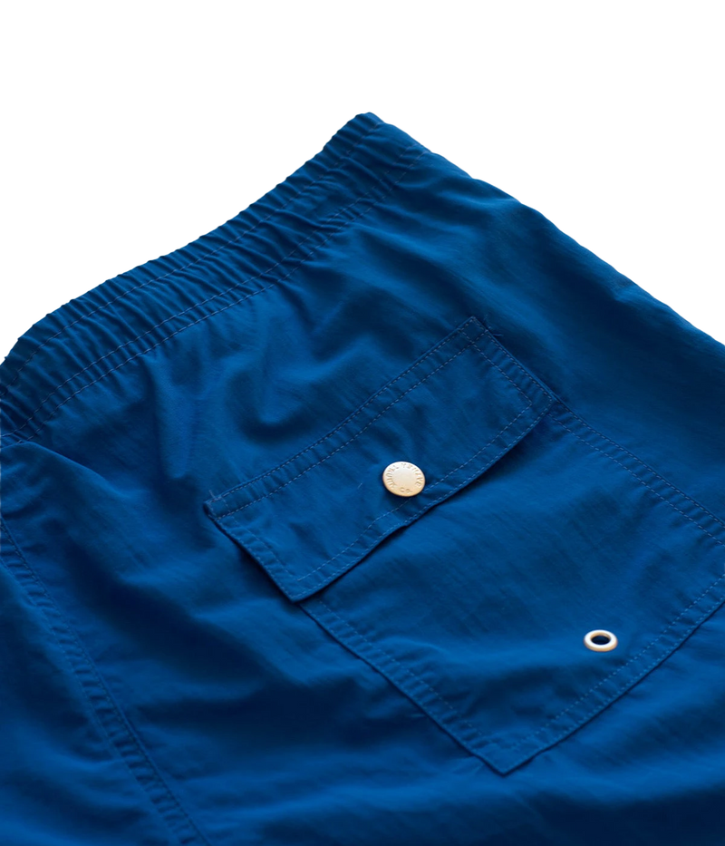 Close-up of Bather swim trunks’ fabric, showcasing the smooth, quick-dry 100% recycled polyester material. The ultra-fine mesh lining offers a soft, barely-there feel with four-way stretch for optimal mobility.
