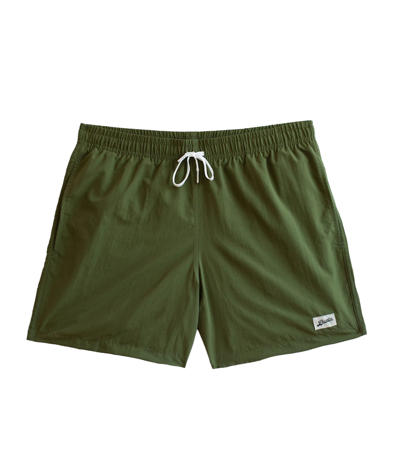 Front view of Bather solid swim trunks, featuring a 5.5-inch inseam and an elasticized waist for a secure and comfortable fit. Made from 100% recycled quick-dry polyester, the trunks are designed with reinforced side pockets and a back pocket with a snap closure.