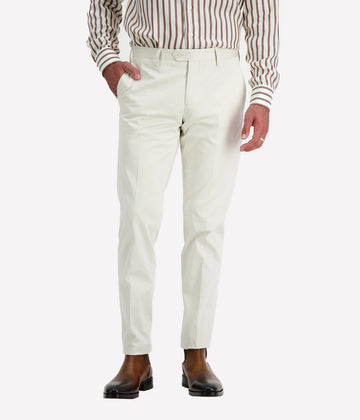 Cream coloured tailored pants by Lardinin crafted from cotton with a single button closure and front pleat.