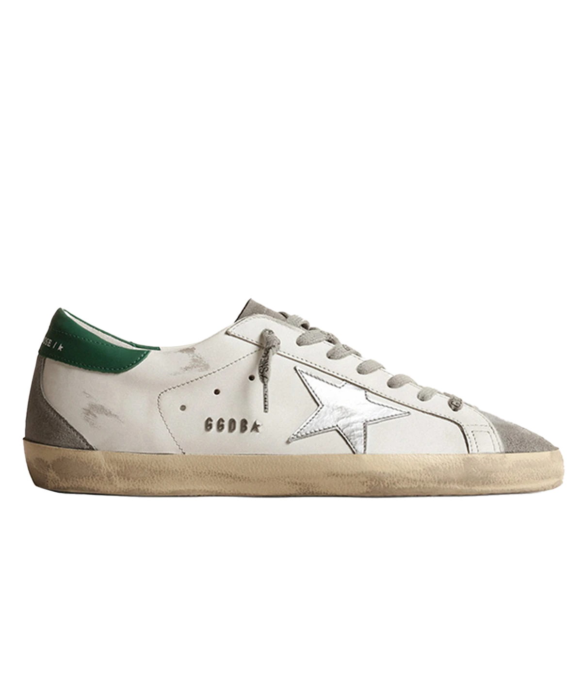 A pair of Golden Goose Super Star Sneakers featuring white calf leather with grey, silver, and green accents. The sneakers have a silver-tone logo print on the side, a signature suede star patch, and a contrasting branded heel counter. Finished with a front lace-up fastening, round toe, and flat rubber sole for added comfort and durability. The design is sleek and modern, making it ideal for casual, everyday wear.