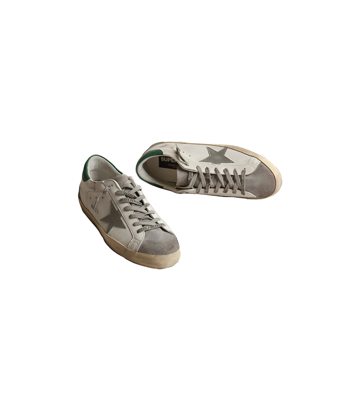 A pair of Golden Goose Super Star Sneakers featuring white calf leather with grey, silver, and green accents. The sneakers have a silver-tone logo print on the side, a signature suede star patch, and a contrasting branded heel counter. Finished with a front lace-up fastening, round toe, and flat rubber sole for added comfort and durability. The design is sleek and modern, making it ideal for casual, everyday wear.