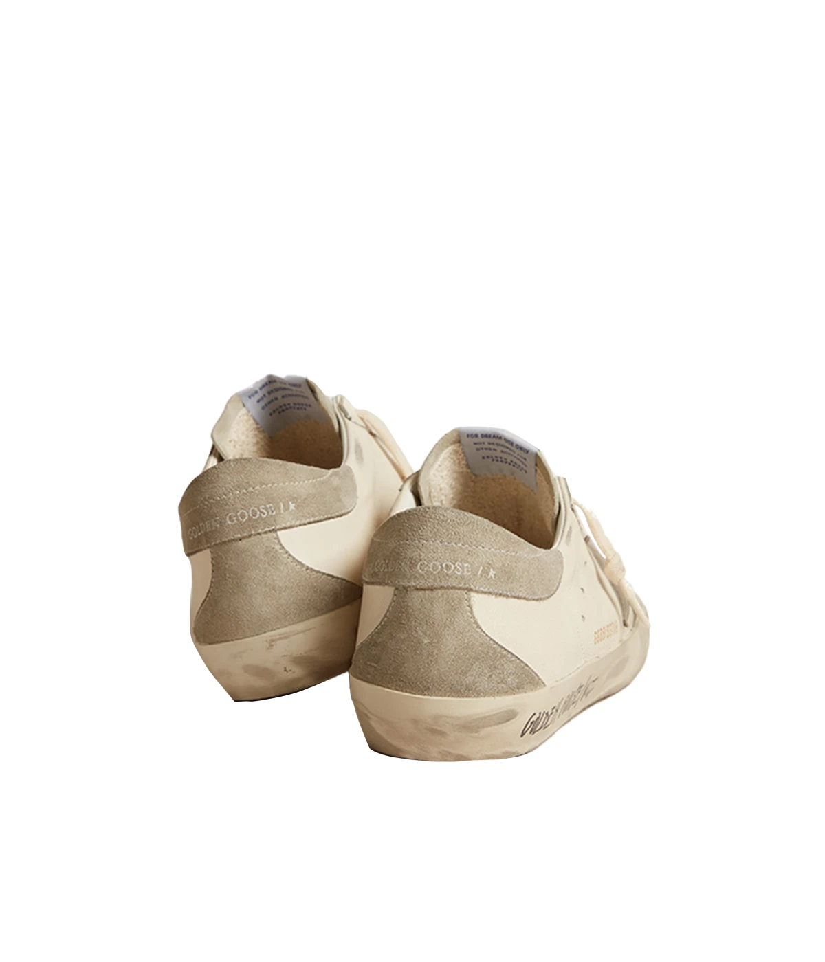 A pair of Golden Goose Super Star Sneakers in off-white calf leather with grey accents. The sneakers feature perforated detailing, a signature suede star patch on the sides, and a logo patch at the tongue. The contrasting grey branded heel counter adds an extra touch of style. Designed with a front lace-up fastening, round toe, and flat rubber sole for comfort and durability, these sneakers are perfect for casual everyday wear.