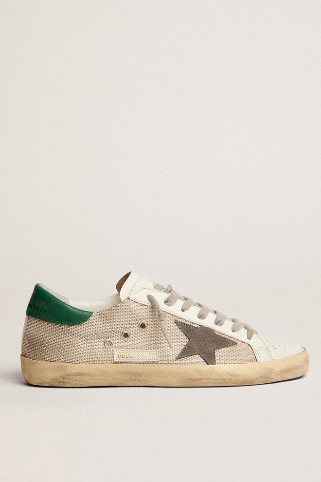 Side profile of the Golden Goose Super-Star Sneaker in Silver and Basalto, featuring the signature suede star and contrasting leather heel for a bold, streetwear-inspired style.