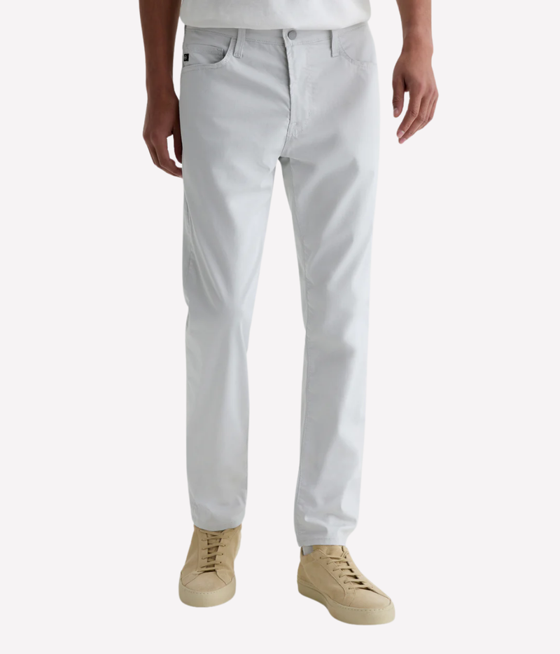 AG Tellis slim fit jeans in 'Almost White' Airluxe™ sateen—lightweight, breathable, and tailored with a tapered leg for modern comfort.