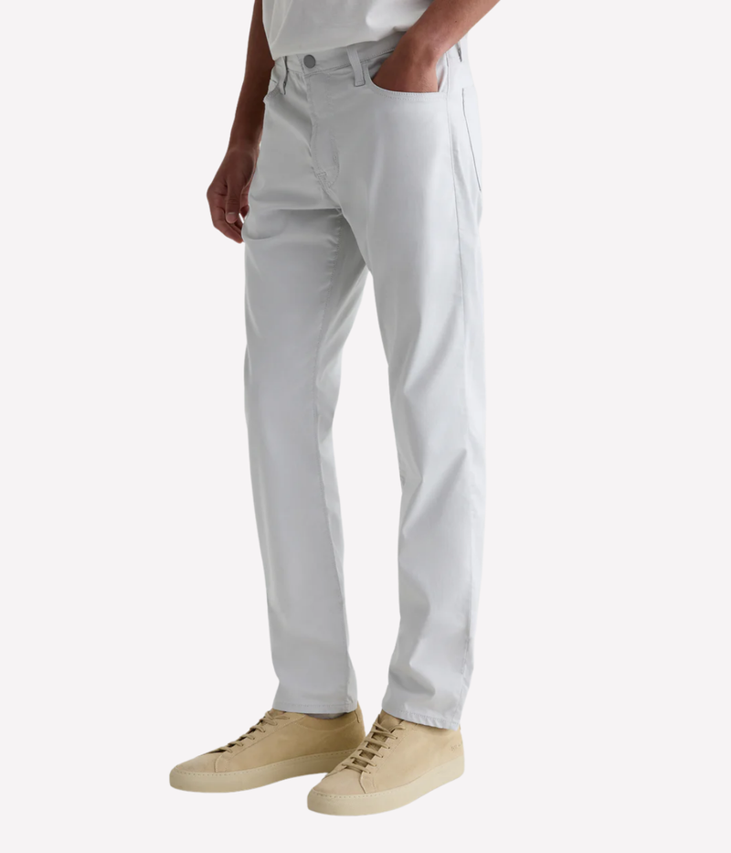 AG Tellis slim fit jeans in 'Almost White' Airluxe™ sateen—lightweight, breathable, and tailored with a tapered leg for modern comfort.