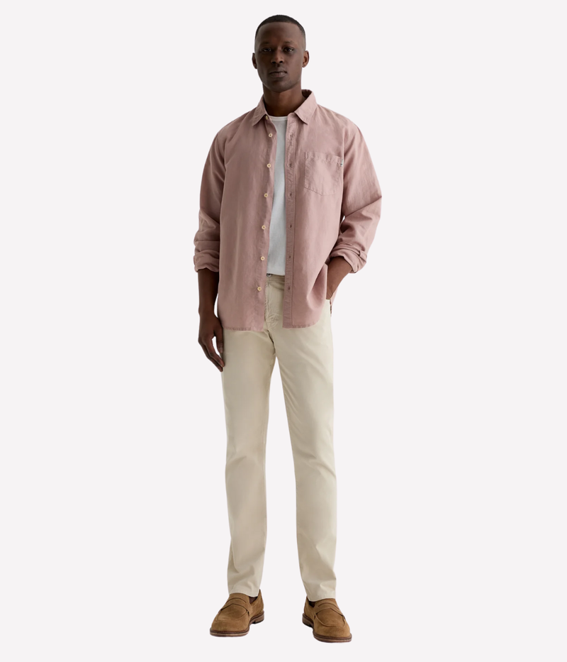 AG Tellis jeans in Natural Ivory, crafted from sueded stretch sateen with a slim fit, tapered leg, and soft brushed texture for elevated everyday wear.