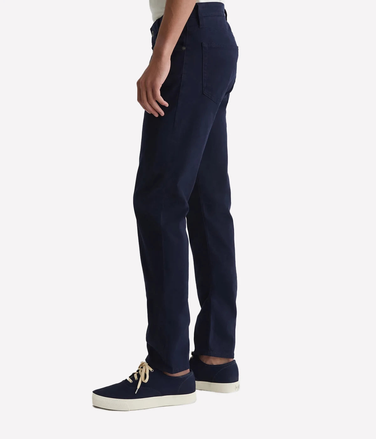 Men’s pants in a brushed finish sueded stretch sateen fabric, with a smooth and refined texture.