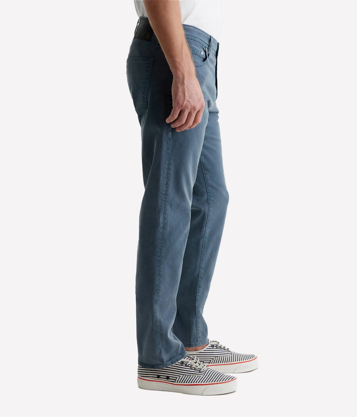 AG Tellis Slim Fit pants in a sulfur-dyed dark blue shade, featuring a fitted upper block and tapered leg. Crafted from lightweight Sueded Stretch Sateen from Italy, these five-pocket men's pants offer refined style and exceptional comfort. Measurements include a 10" front rise, 15 3/4" knee opening, 13 3/4" bottom opening, and 34" inseam.