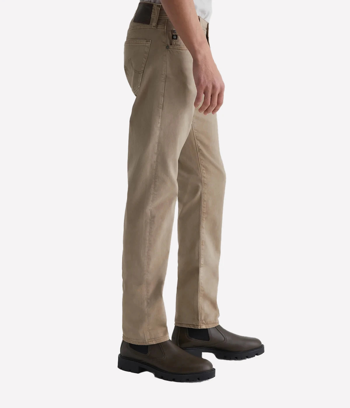 Tellis modern slim-fit jeans for men in a sulfur-dyed beige wash. Featuring faded details and worn pocket edges that replicate 7 years of wear. Crafted from a stretch-enhanced blend for comfort and style.