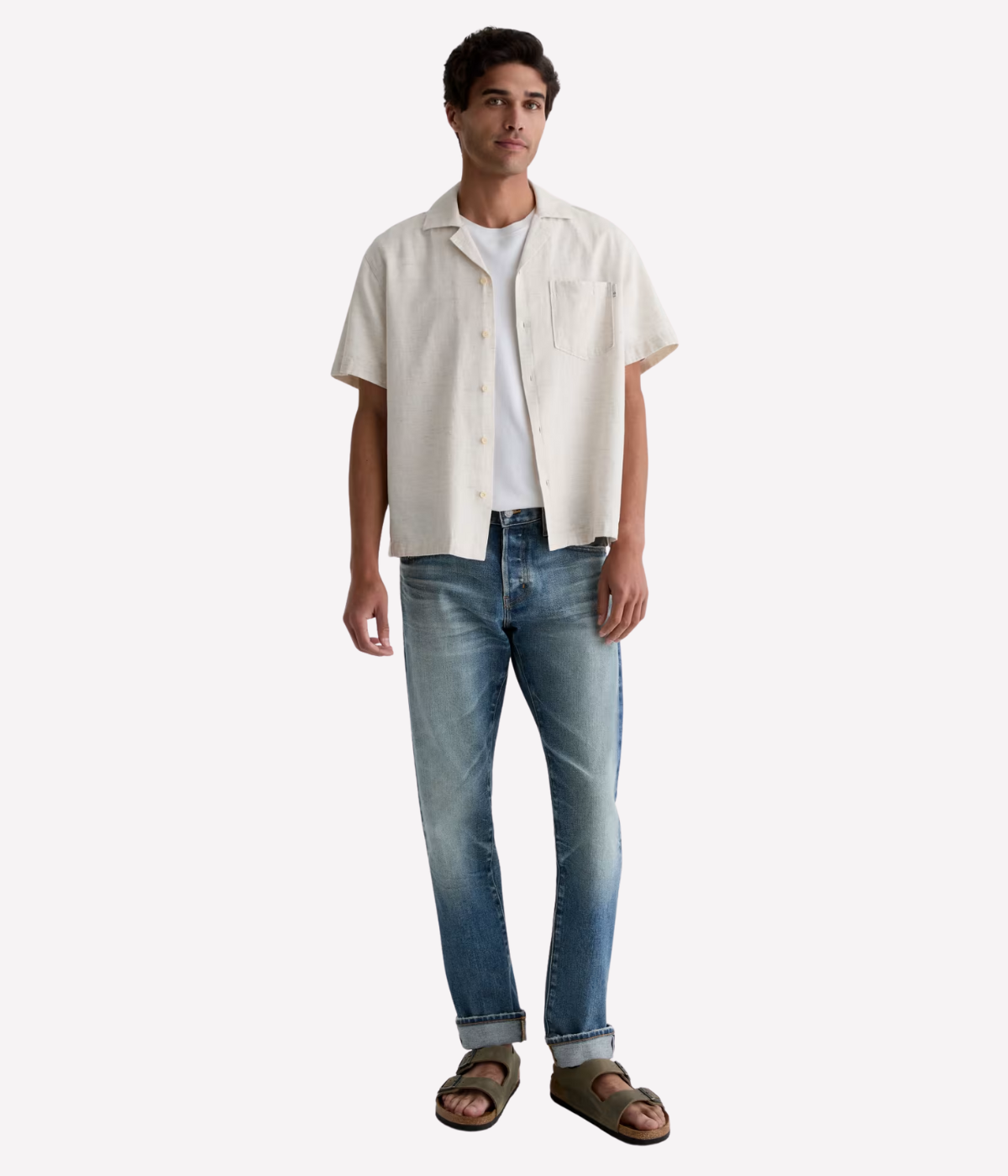 Men’s AG Tellis jeans in 14-year faded blue AG-ed™ wash, crafted from Japanese stretch selvage denim with a modern slim fit and tapered leg.