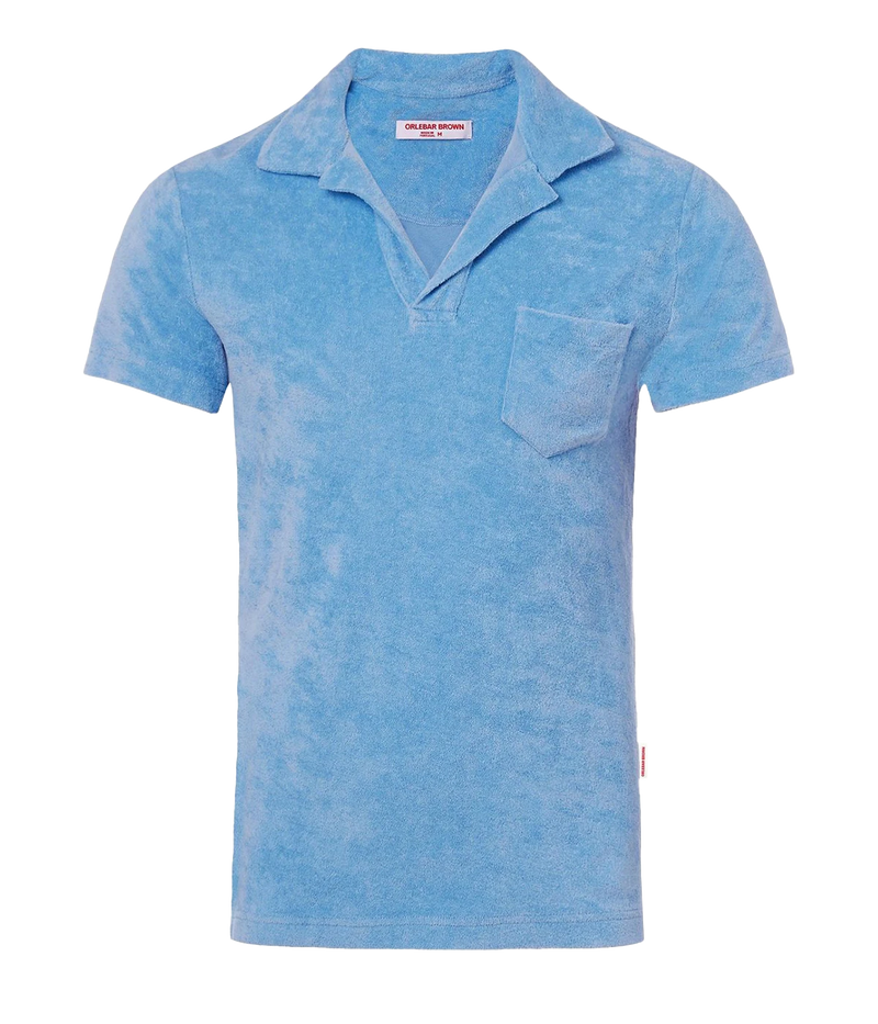 A flat lay of the Orlebar Brown Terry Towelling Polo in summer blue, showcasing its soft texture and tailored silhouette.