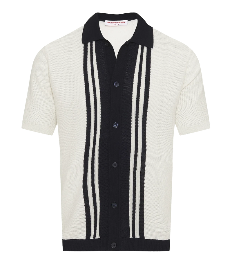 Men’s Tiernan classic fit shirt made from organic mercerised cotton piqué with Milano collar and contrast stripe stitch detail, displayed under soft candlelight.