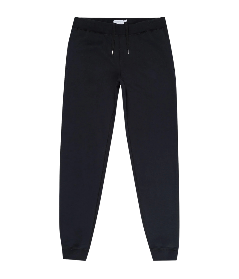 Men’s slim fit track pants in black, crafted from loopback cotton with ribbed waistband and tapered leg—part of a matching track set.