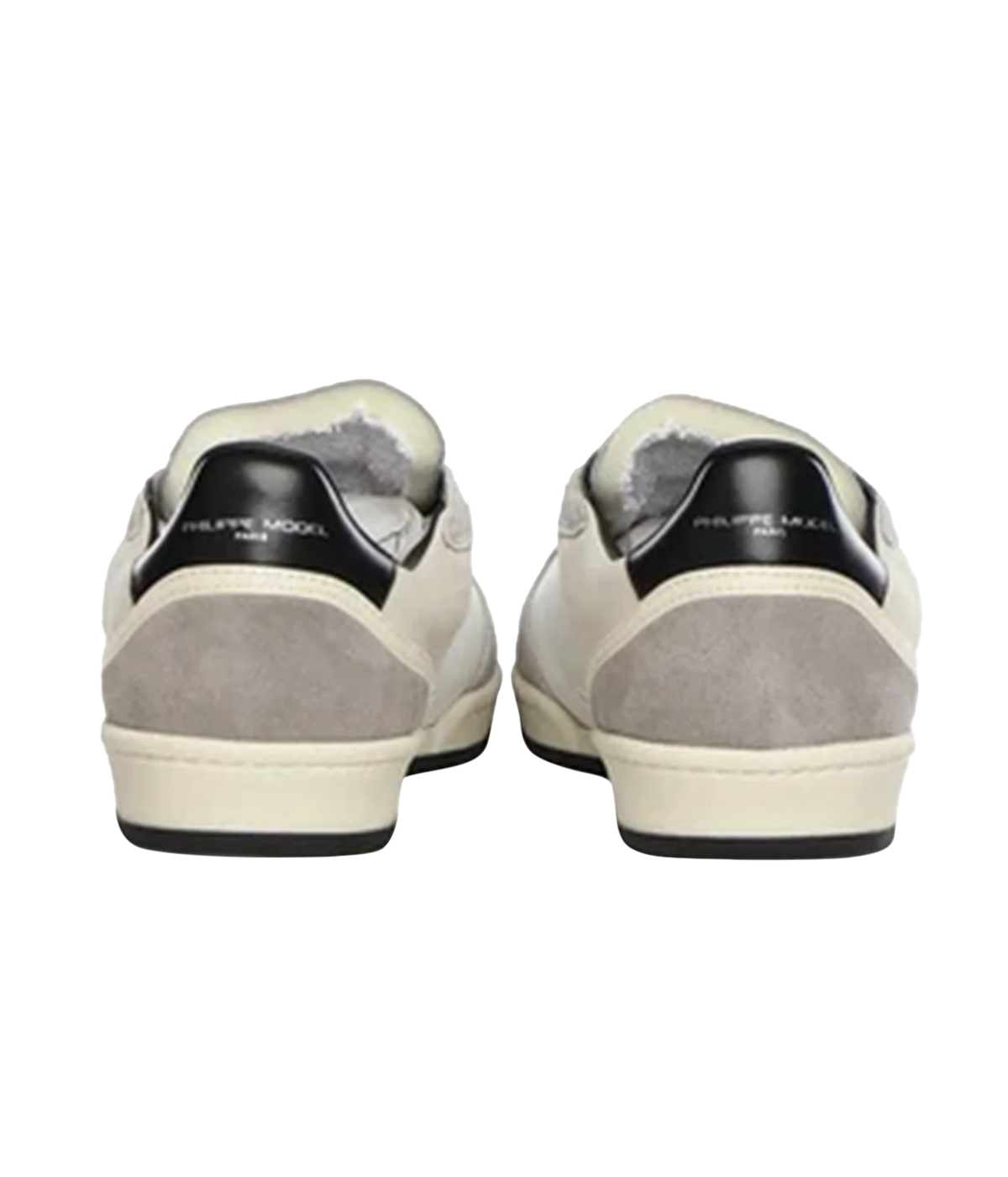 A pair of Ralph Lauren sneakers shown from the back, featuring cream leather uppers, light gray suede panels, black heel tabs with white branding, and a cream sole with a black outsole.