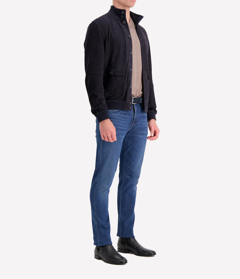 The Valstar Suede Jacket, a modern twist on the classic A1 flight jacket, featuring a luxurious goat suede texture and ribbed trims for a sporty yet sophisticated silhouette.