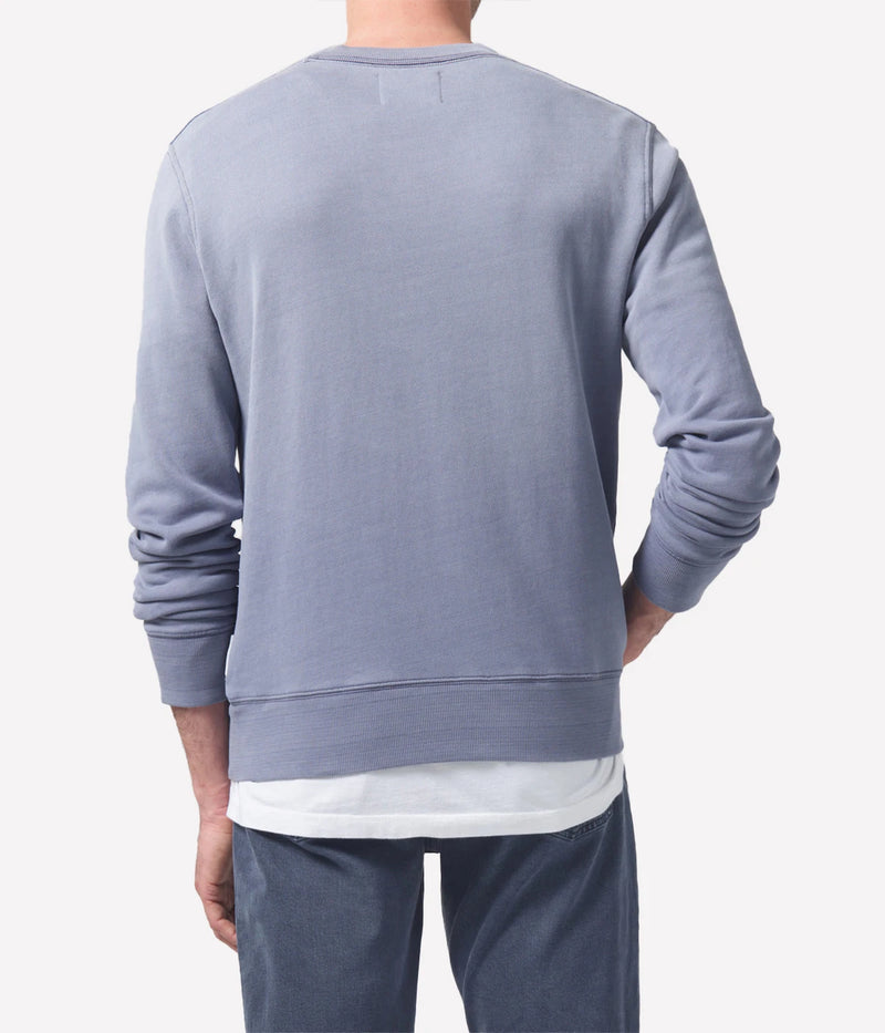 Vintage crewneck in 100% organic cotton, featuring a standard slim fit and indigo sueded fleece, softening over time, with detailed measurements for perfect layering.