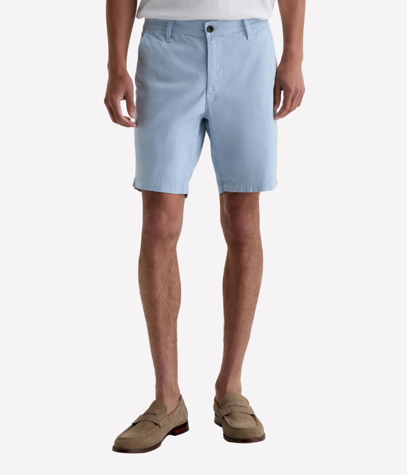 AG Wanderer Shorts in light blue with a slim fit, tapered leg opening, and ultra-lightweight cotton-blend fabric, made in the USA.