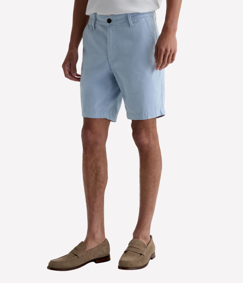 AG Wanderer Shorts in light blue with a slim fit, tapered leg opening, and ultra-lightweight cotton-blend fabric, made in the USA.