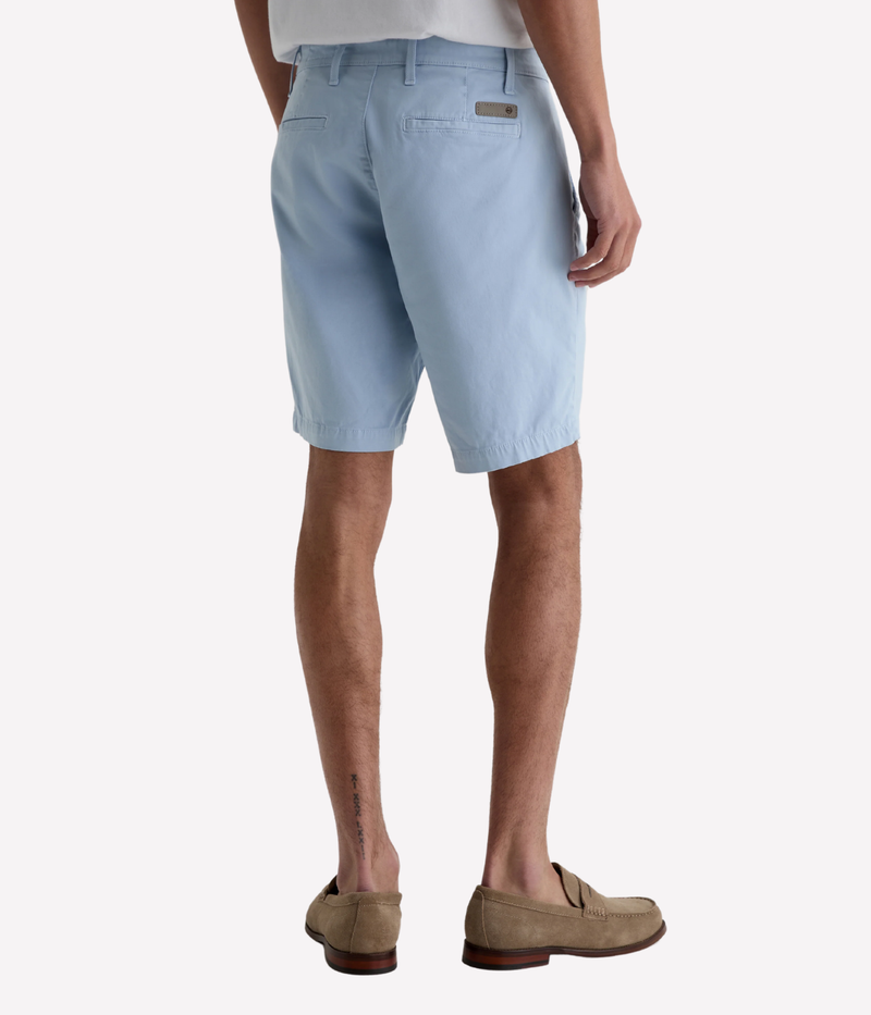 AG Wanderer Shorts in light blue with a slim fit, tapered leg opening, and ultra-lightweight cotton-blend fabric, made in the USA.