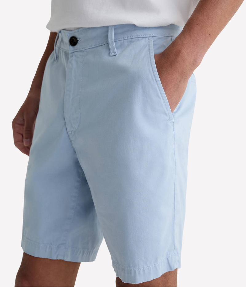 AG Wanderer Shorts in light blue with a slim fit, tapered leg opening, and ultra-lightweight cotton-blend fabric, made in the USA.