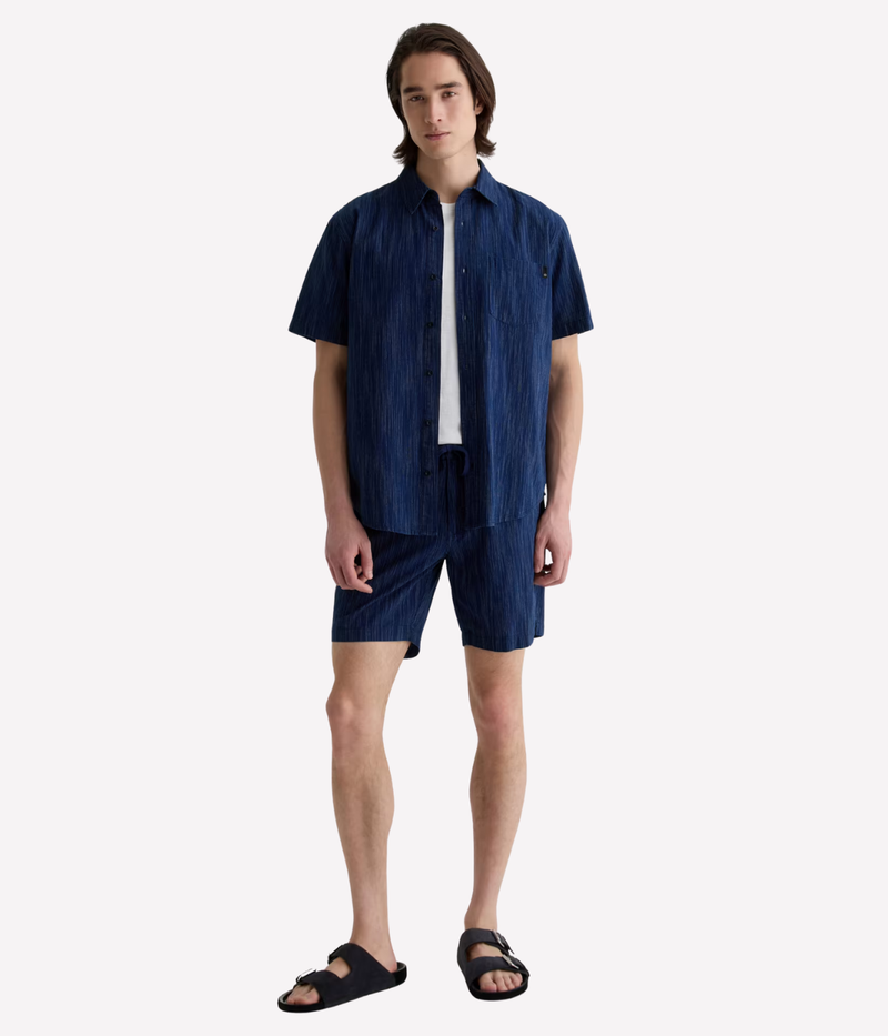 Relaxed short sleeve chambray shirt in a textured blue wash with chest pocket – the perfect laid-back summer button-up.