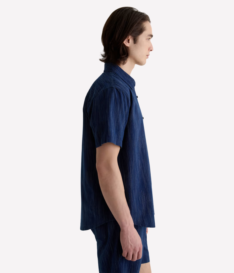 Relaxed short sleeve chambray shirt in a textured blue wash with chest pocket – the perfect laid-back summer button-up.