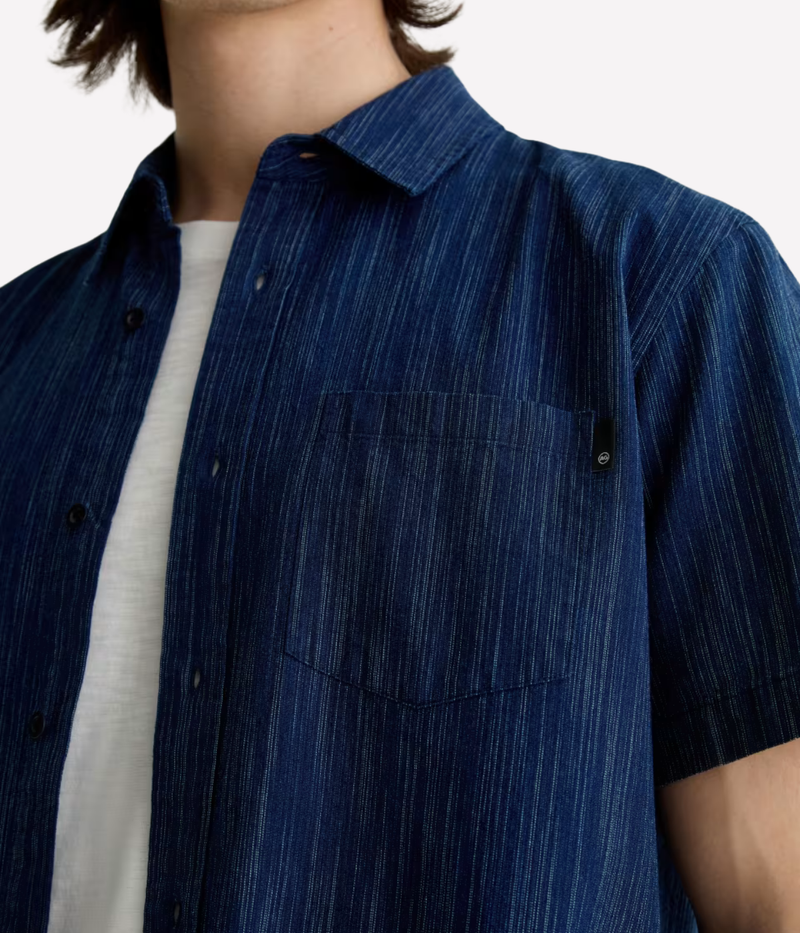 Relaxed short sleeve chambray shirt in a textured blue wash with chest pocket – the perfect laid-back summer button-up.