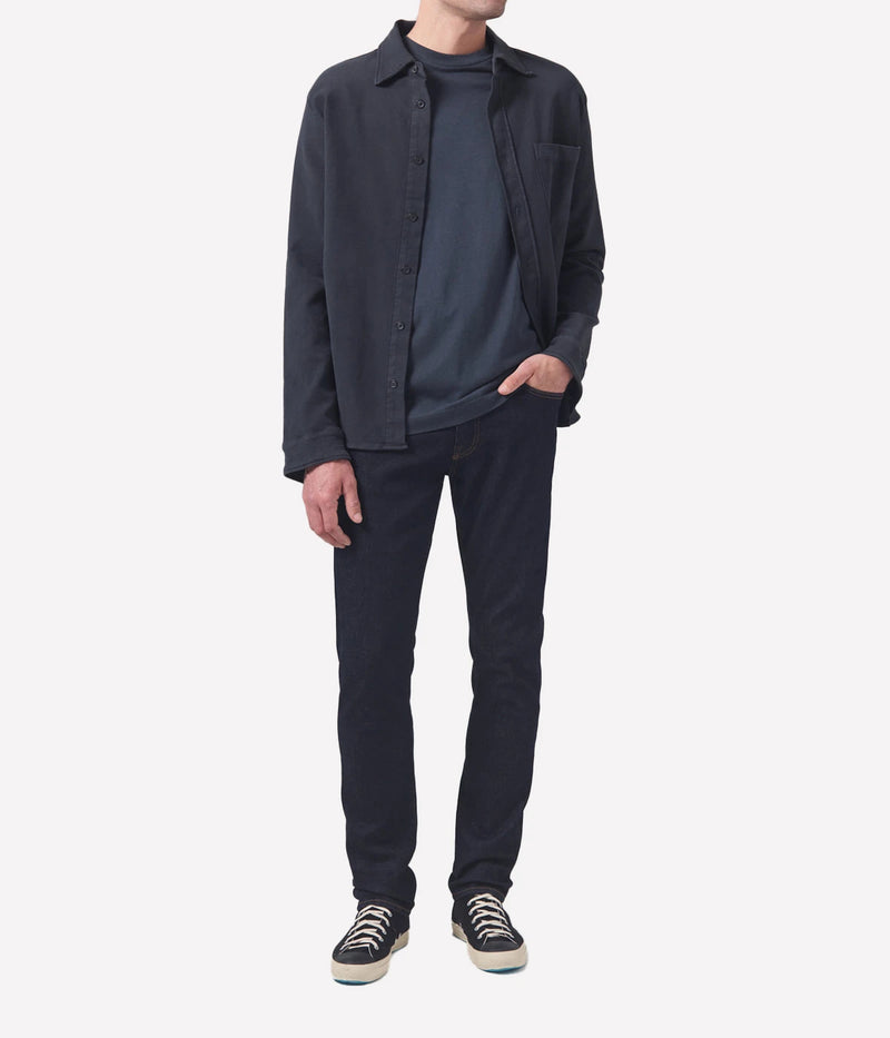 Adler Jean, featuring a low-rise waist and tapered leg design. Inspired by the city’s rock scene, this minimalist jean is crafted from a blend of lyocell, organic cotton, modal, polyester, and elastane for a comfortable and flexible fit, free from unnecessary embellishments.