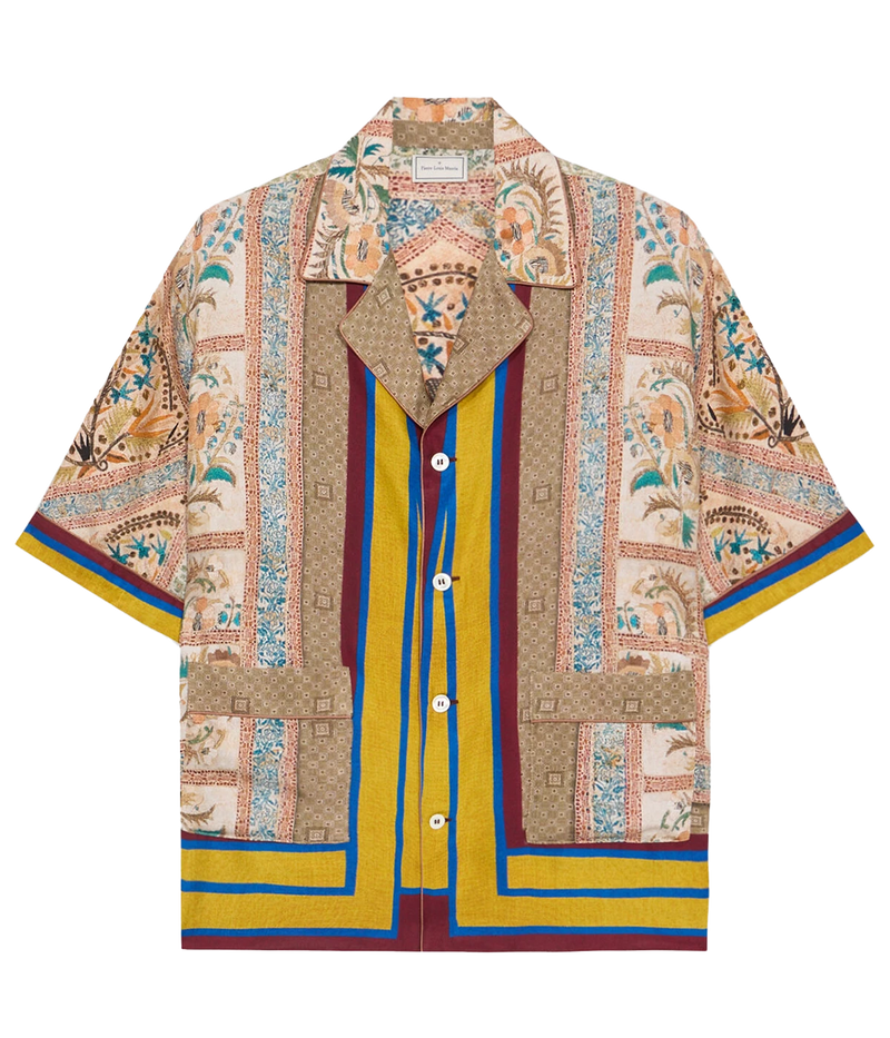 Warm-toned geometric print silk shirt with pops of blue and yellow, notched collar, and short sleeves.