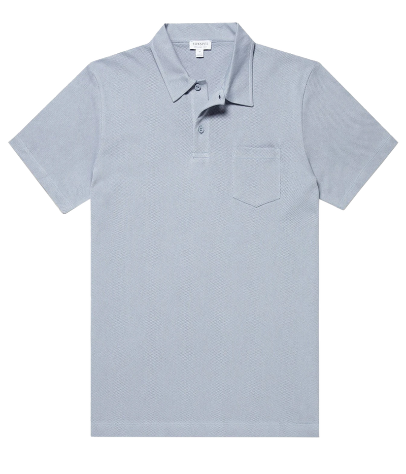A light blue short-sleeve polo shirt with a classic collar, three-button placket, and a single chest pocket, shown flat against a white background.