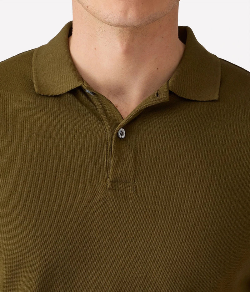 Close-up of a man wearing an olive green polo shirt, showing the collar, button placket, and textured fabric.