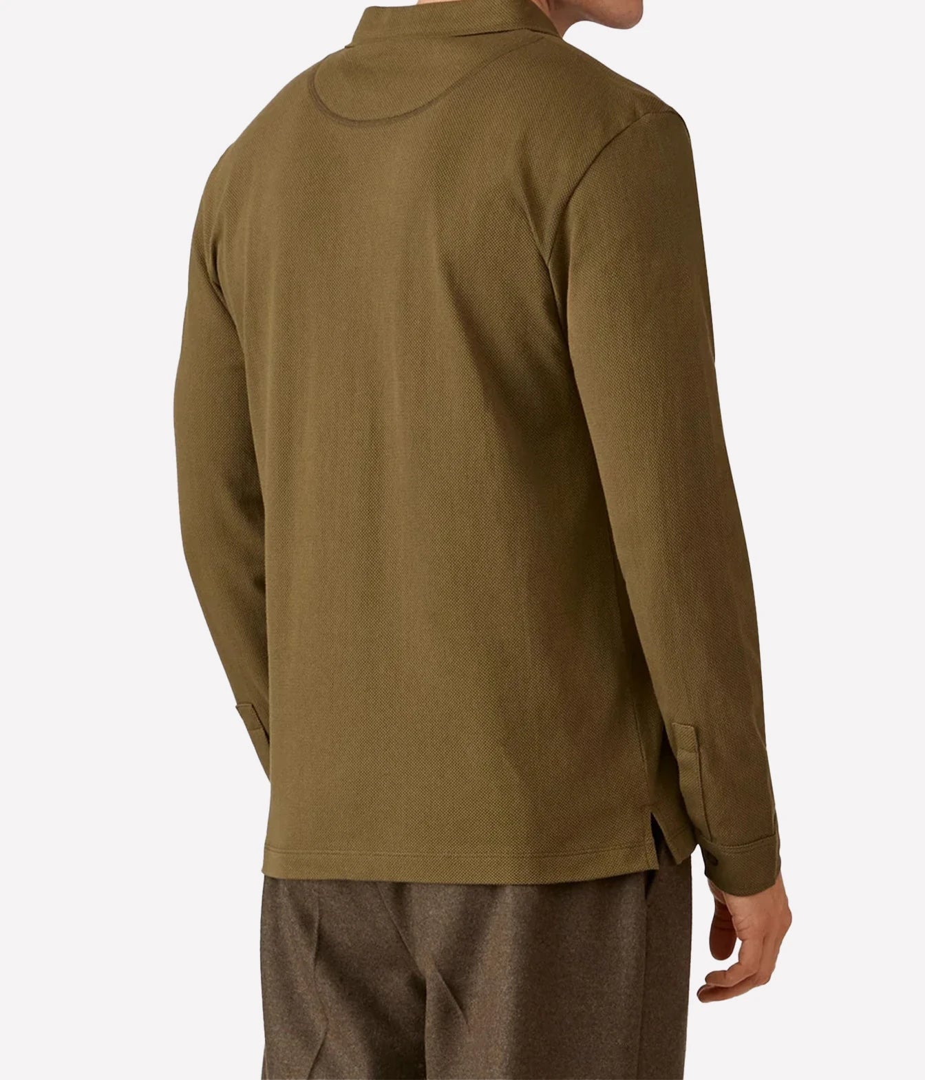 A man wearing an olive green long-sleeve shirt, shown from the back against a plain light gray background.