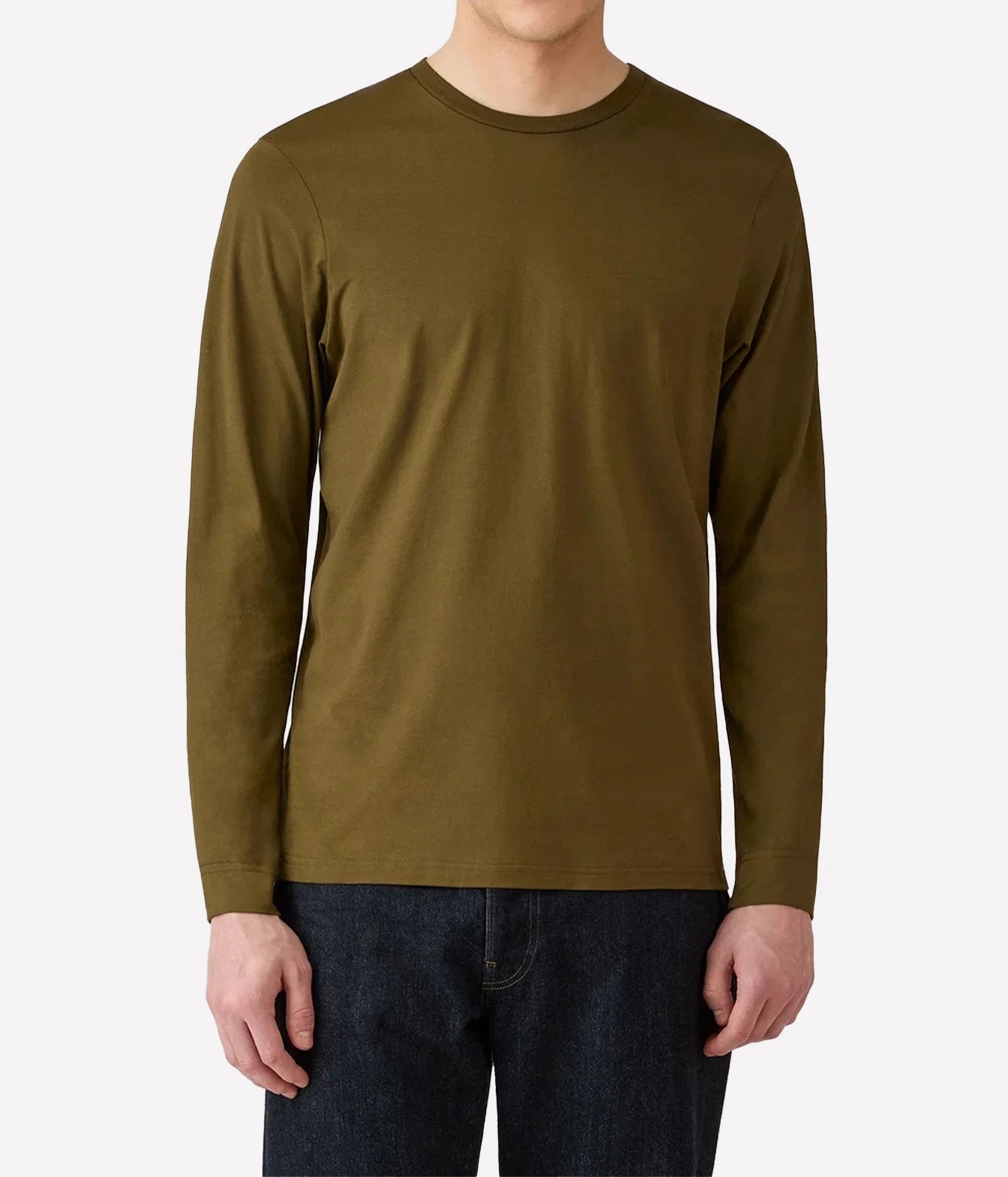 A man wearing a solid olive green long-sleeve crewneck t-shirt and dark blue jeans, shown from the neck down against a light gray background.