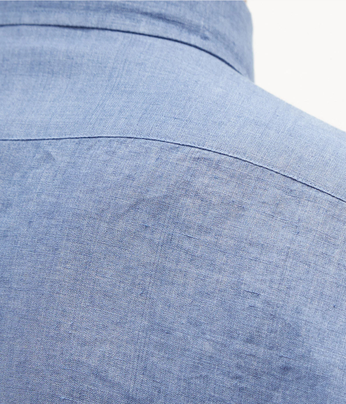 Close-up of the Antonio Long Sleeve Linen Shirt by Frescobol Carioca, crafted from premium fine Italian linen. The smooth texture and lightweight feel of the fabric ensure comfort and elegance, enhanced by imitation mother of pearl buttons for a sophisticated finish.