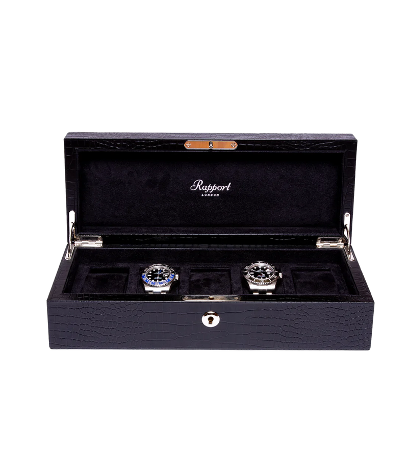 The Brompton 5-piece watch box in black crocodile-effect leather, featuring a luxurious suede interior. The box is finished with gold fitments, a lock, and key, exuding refined elegance.