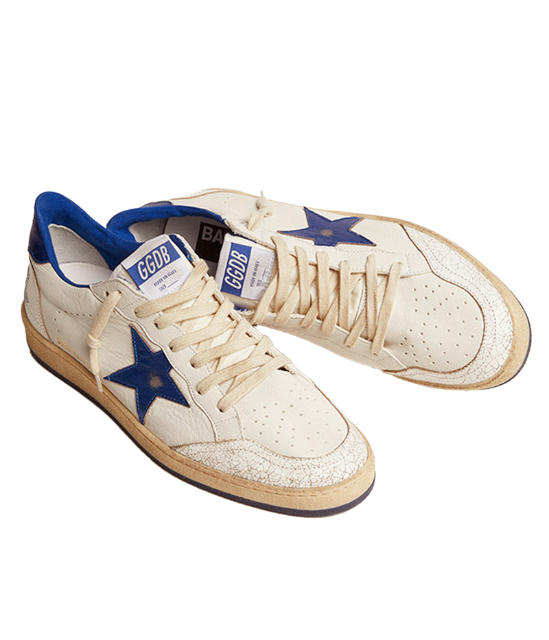 Golden Goose Ball Star sneakers channel an '80s American college and basketball vibe. Crafted in white nappa leather, they feature a metallic navy leather star and heel tab, along with white crackle-leather inserts. The sneakers are completed with white laces, giving them a vintage-inspired look with modern appeal.