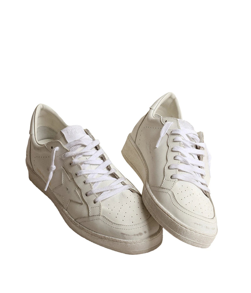 Golden Goose Ball Star sneakers in Optic White, featuring a leather upper and signature star. Inspired by an American college vibe, blending basketball and skate culture. The white leather inserts and tonal laces complete the timeless, stylish look.