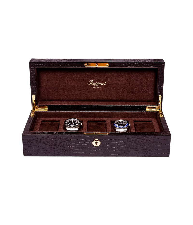 Opened Brompton 5-piece watch box displaying its suede interior and five compartments designed to store and protect your watches. Finished in chocolate brown leather with gold detailing.