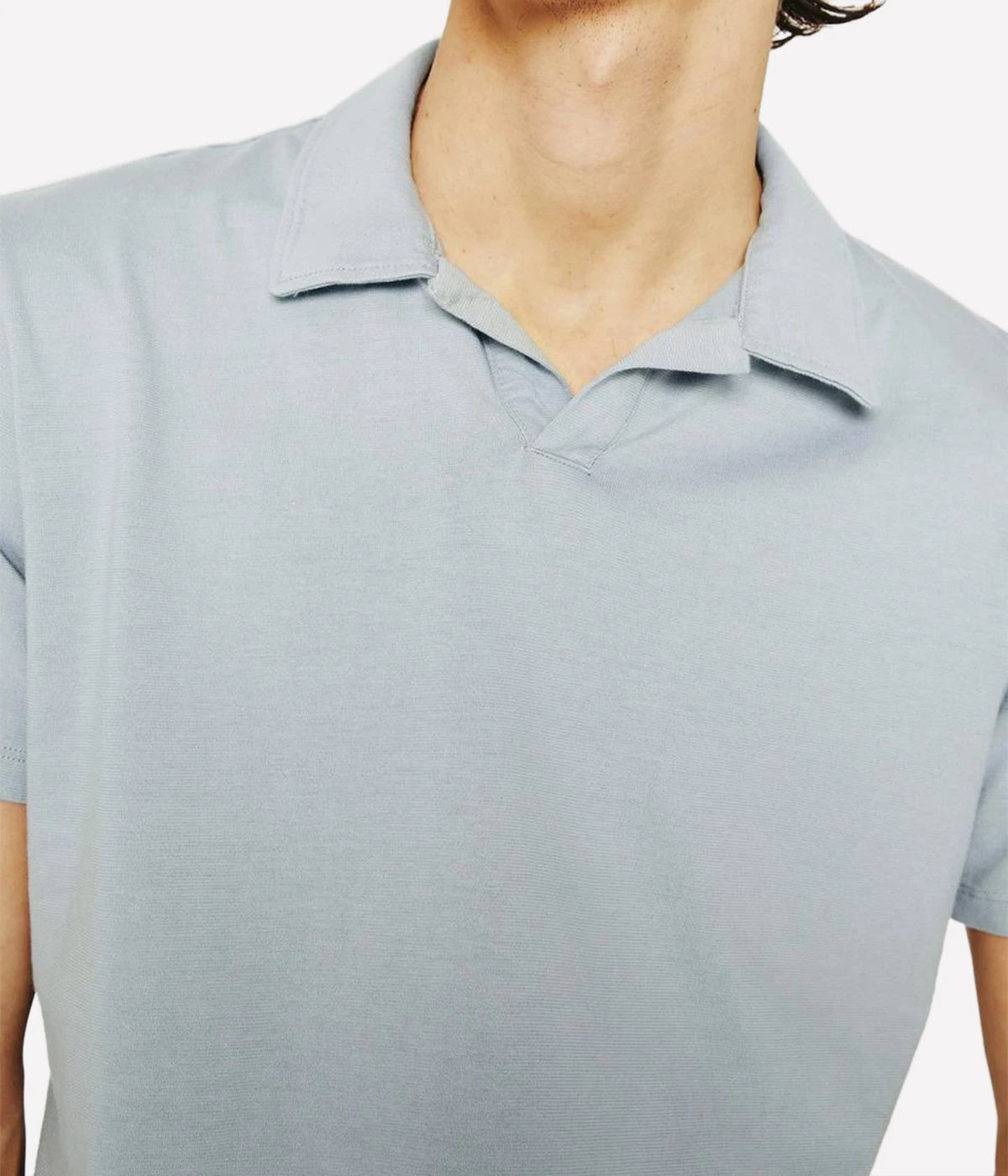 Close-up of the Bryce Johnny Collar polo shirt, focusing on the finely crafted collar and soft texture of the cotton fabric.