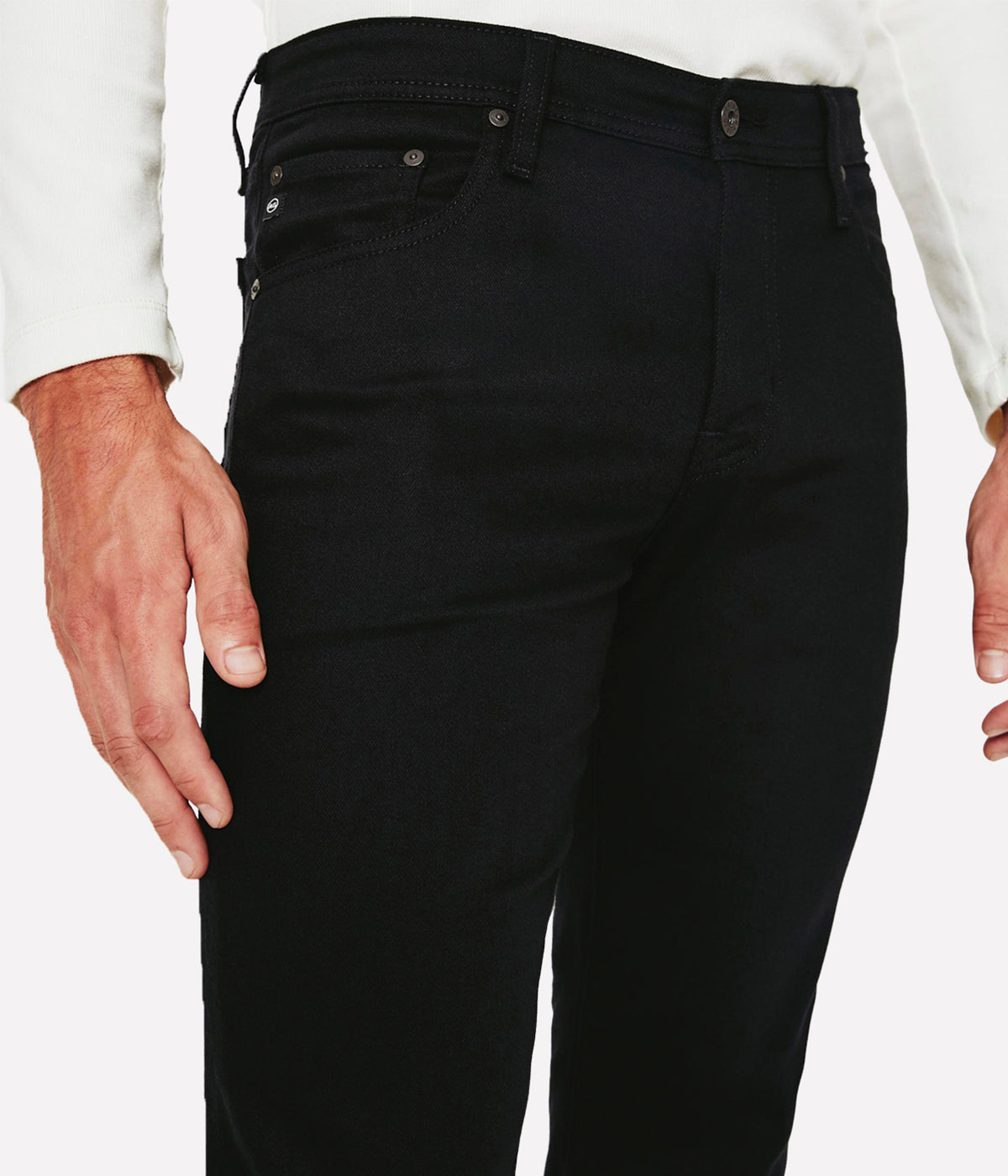 Close-up of the Dylan jeans in rich black, showcasing the smooth texture of the 10 oz. Dover Stretch Denim Stay Black. The fabric features fade-proof technology, ensuring the color stays saturated wash after wash.