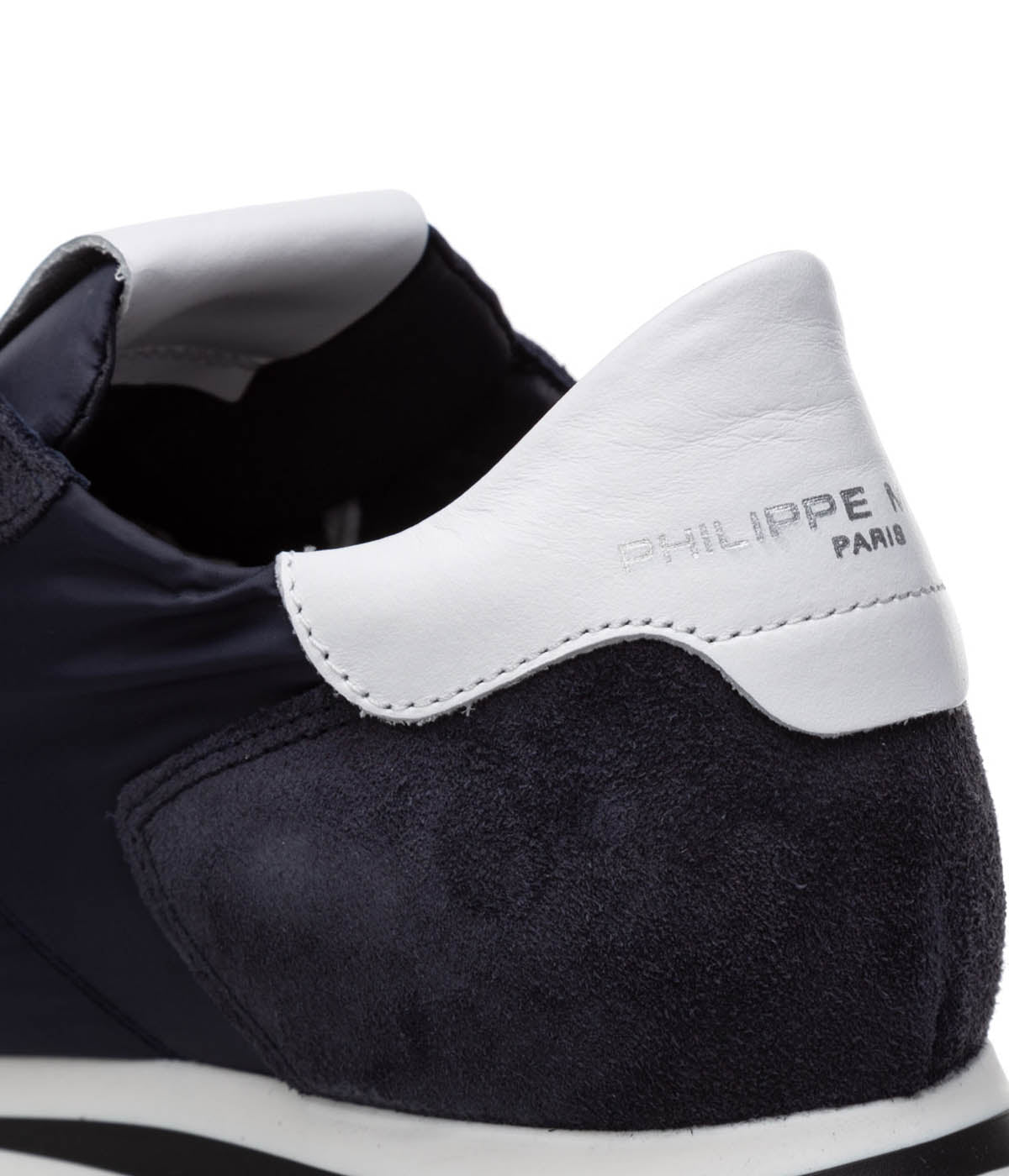 Close-up of Philippe Model TRPX sneaker materials, featuring premium contemporary fabrics with hand-finished details. The vibrant tones and meticulous craftsmanship emphasize their luxurious urban appeal.