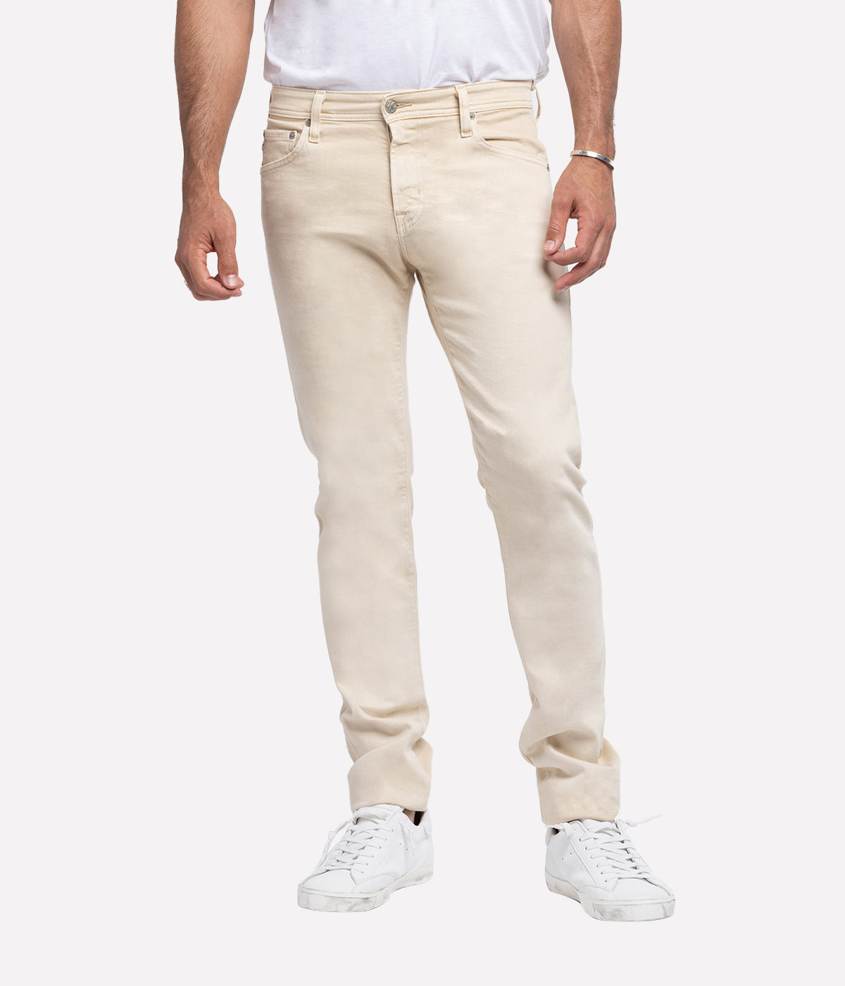 Tellis Modern Slim Jean for men in a sulphur-treated sandy hue, featuring a fitted upper block and tapered leg opening for a sleek, contemporary look. Crafted from 10 oz. Dover Stretch Denim, this versatile men's jean offers a luxurious feel and premium finish, perfect for elevated everyday wear. Ideal for pairing with casual tees or smart button-ups.