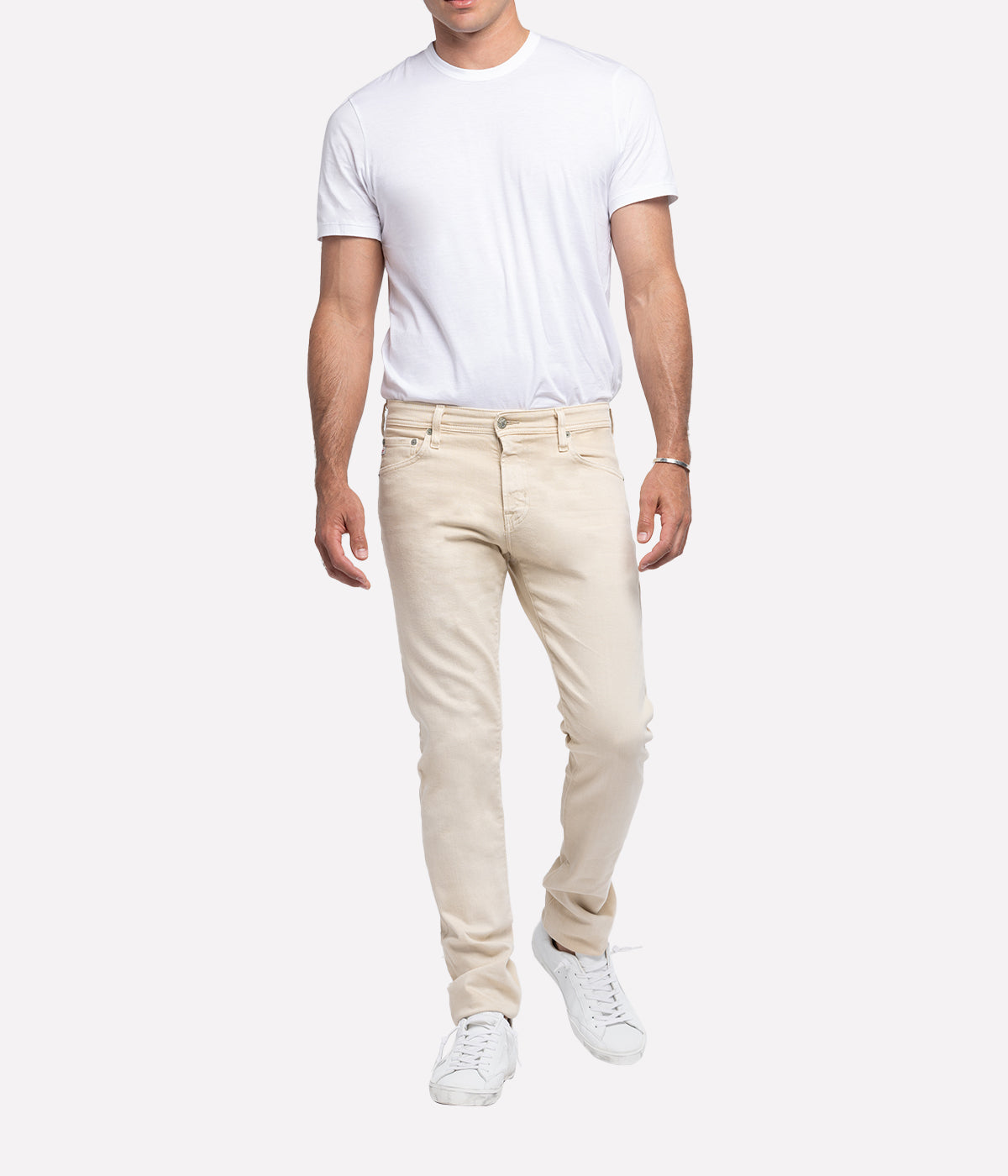 Tellis Modern Slim Jean for men in a sulphur-treated sandy hue, featuring a fitted upper block and tapered leg opening for a sleek, contemporary look. Crafted from 10 oz. Dover Stretch Denim, this versatile men's jean offers a luxurious feel and premium finish, perfect for elevated everyday wear. Ideal for pairing with casual tees or smart button-ups.